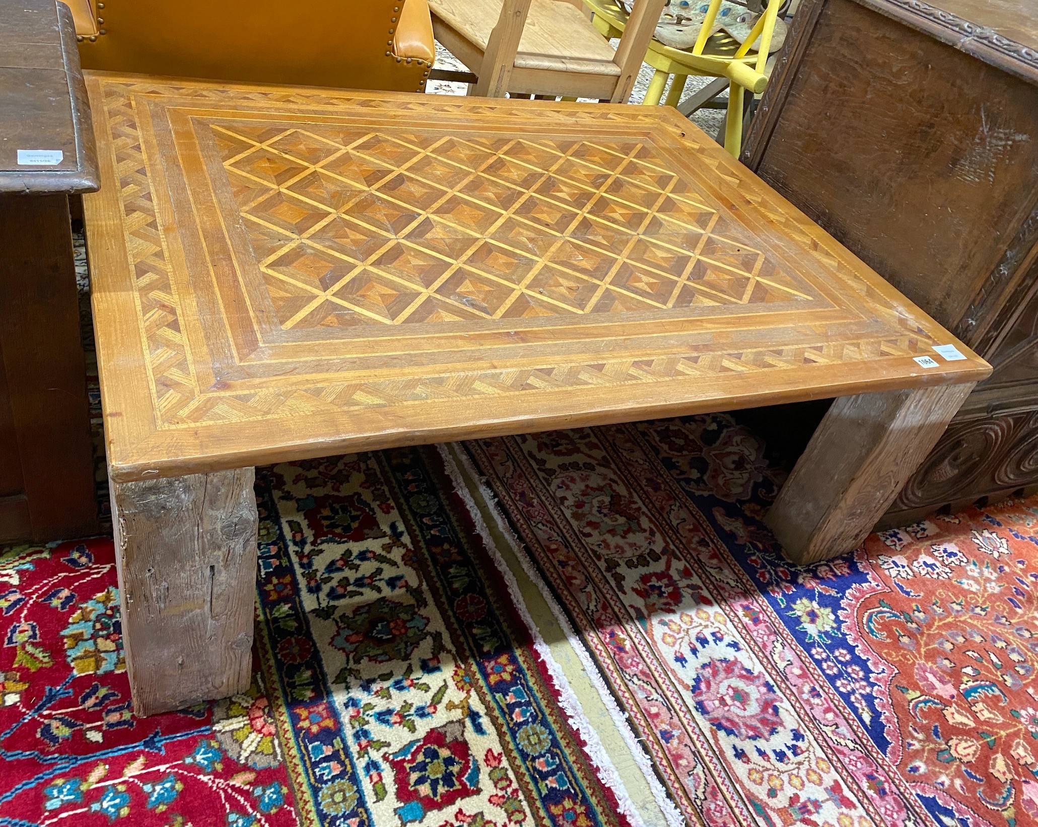 A rectangular parquetry coffee table, width 115cm, depth 89cm, height 40cm